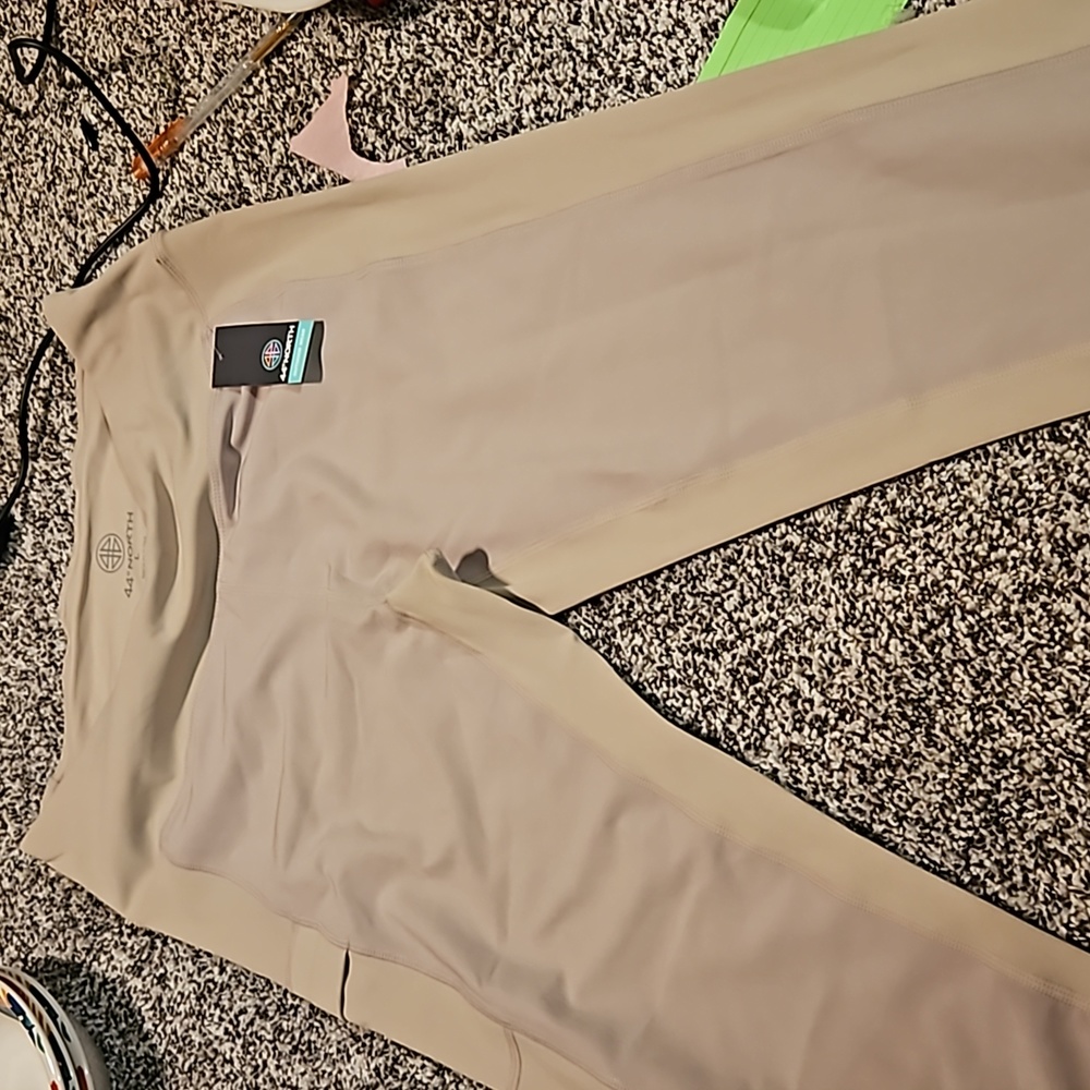 Size L tan leggings 44°North New with tag. Has a pocket on the side.